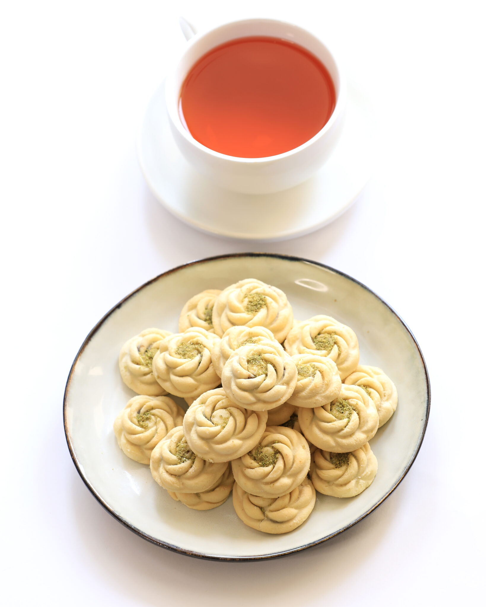 Pistachio Kolompe with a cup of tea